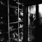 Tuzla, Bosnia and Herzegovina 2009. Emina Kurtalic, project manager at the Podrinje Identification Project, pushes an elevator trolley in order to store a corpse in a refrigerator unit. There are thousands of human remains catalogued in the PIP at Tuzla. Photo - Matteo Bastianelli