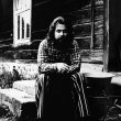 © Uģis Niedre. The poet and ethnographer Juris Kunnoss (1948-1999) near the pump master Janis Bardins’ house Medni in Drusti district (now - Zosenu district), Cesis region