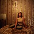 Rafal Milach. Nastya posing for portrait in her room. From "7 Rooms".