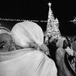 Linda Dorigo. West Bank, Bethlehem, December 2012. On Christmas night, Ethiopians dance in the square in front of the Church of the Nativity in Bethlehem. They are prevented from entering the church. In the Holy Land, Christmas is celebrated four times: by Catholics on December the 25th, on January the 6th by Orthodox, by Greek Orthodox on January the 13th, then on January the 21th by the Armenians.